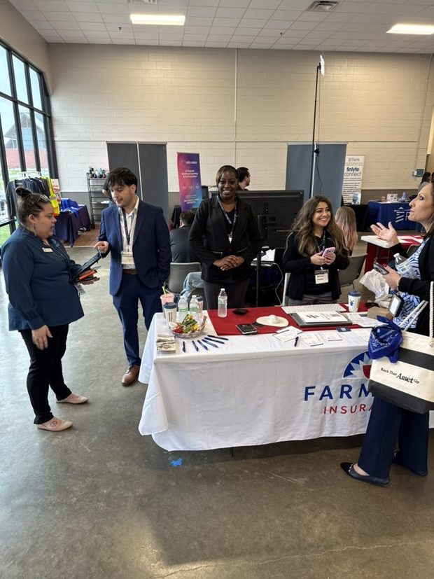 Rasheda, a Farmers protege, being supported by Austin District staff at the 2026 Austin National Business Expo
