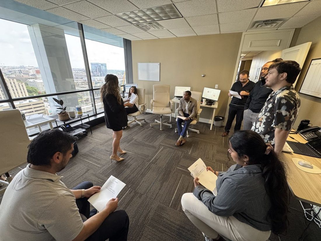 District Manager leading a team training session at The Austin District office