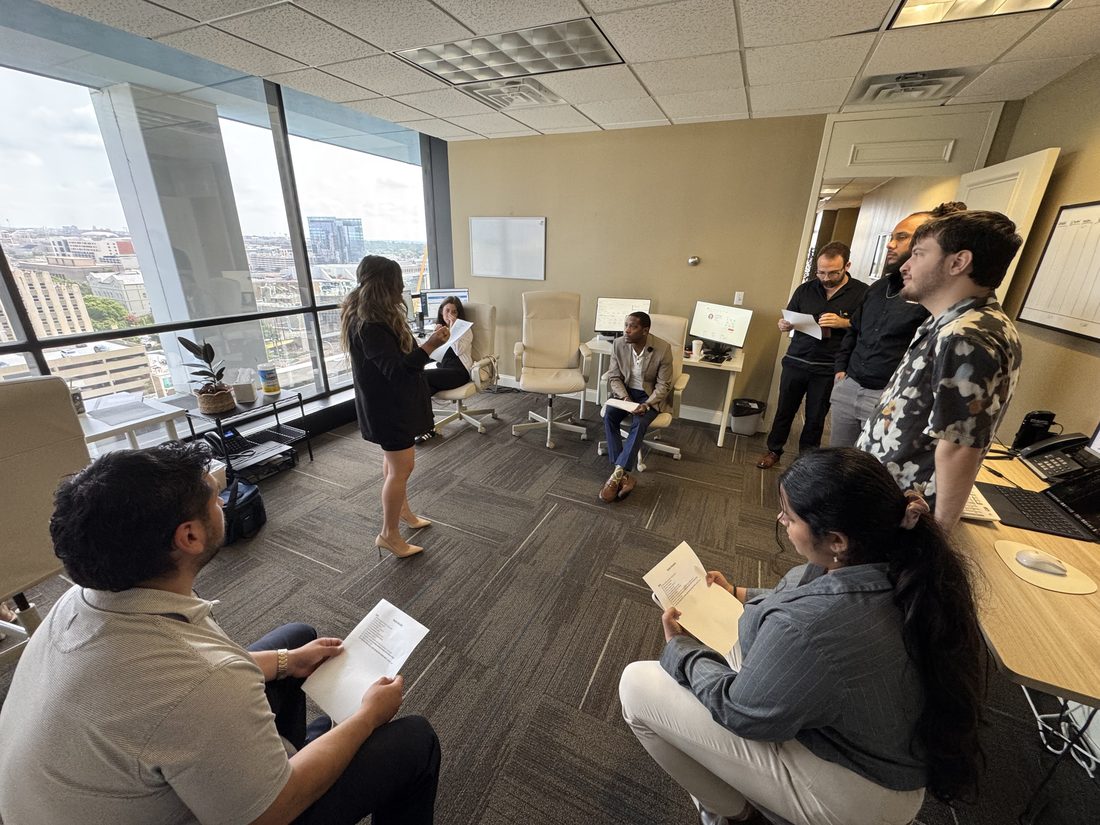 Melissa Casillas leading a team training session at The Austin District office