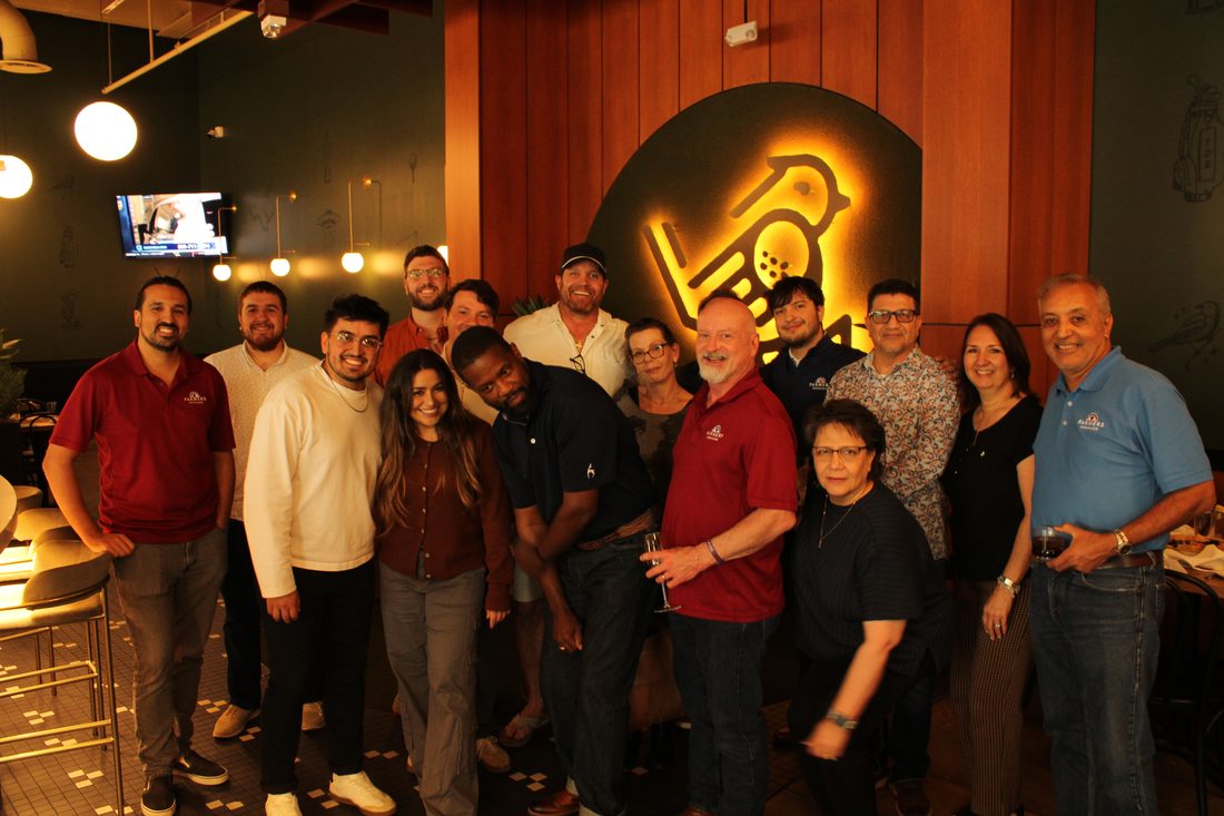 The Austin District agents and staff gathered together for a team dinner